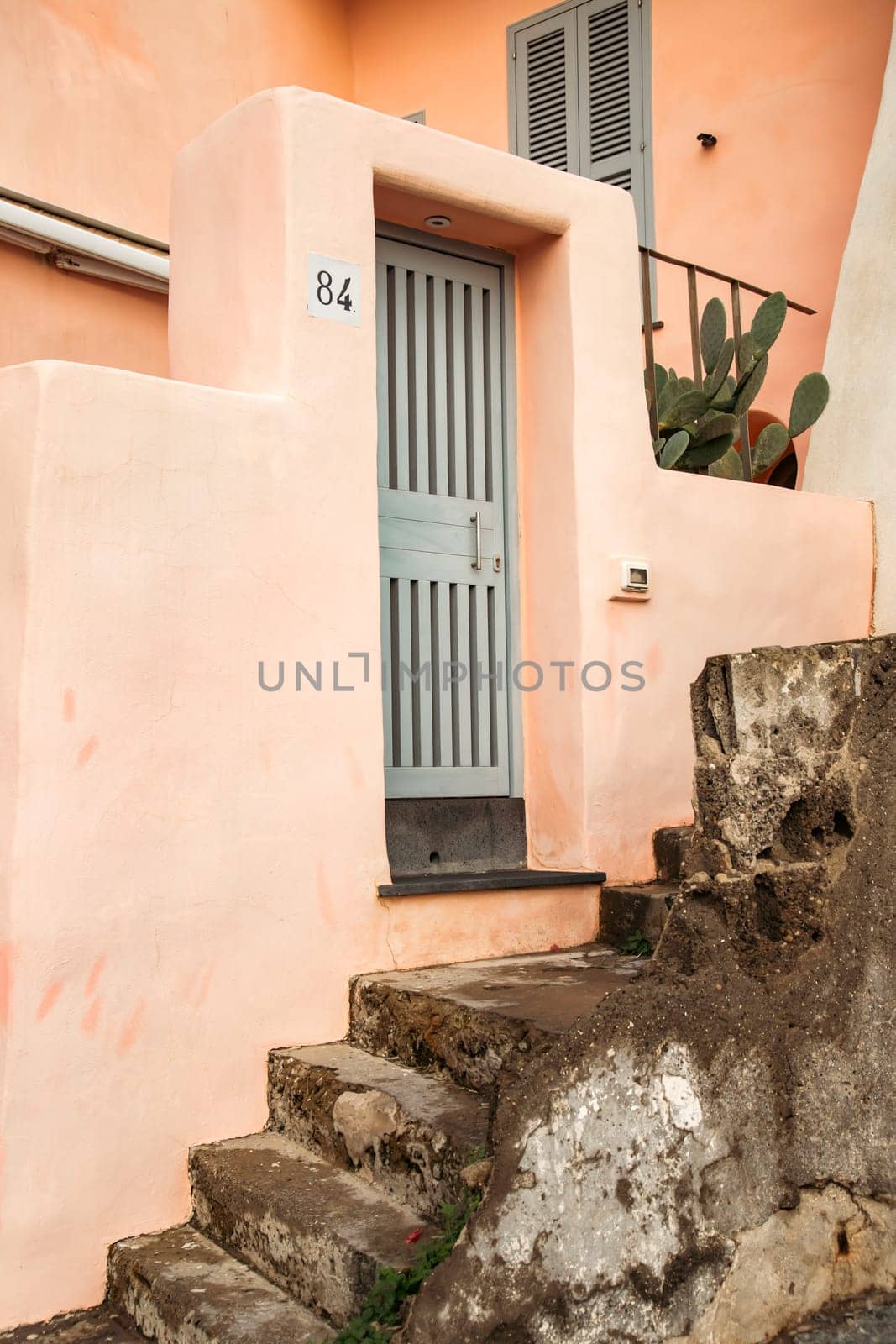 Procida island with colorful houses in small town street