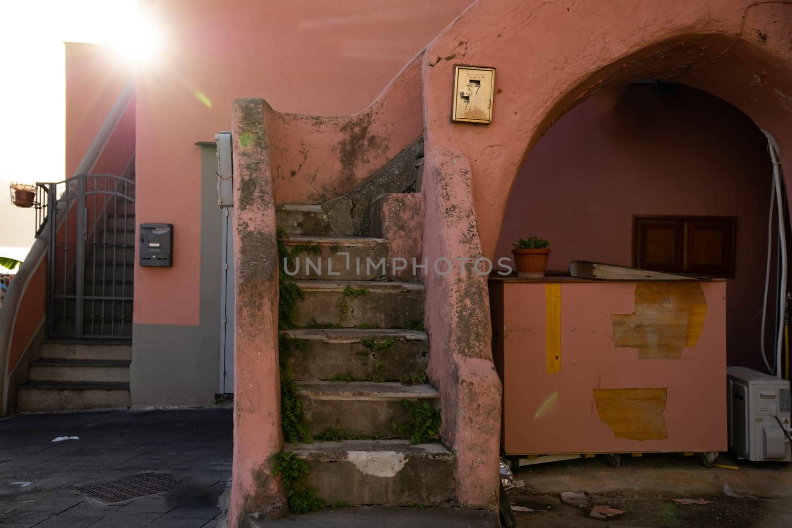 Procida island with colorful houses in small town street