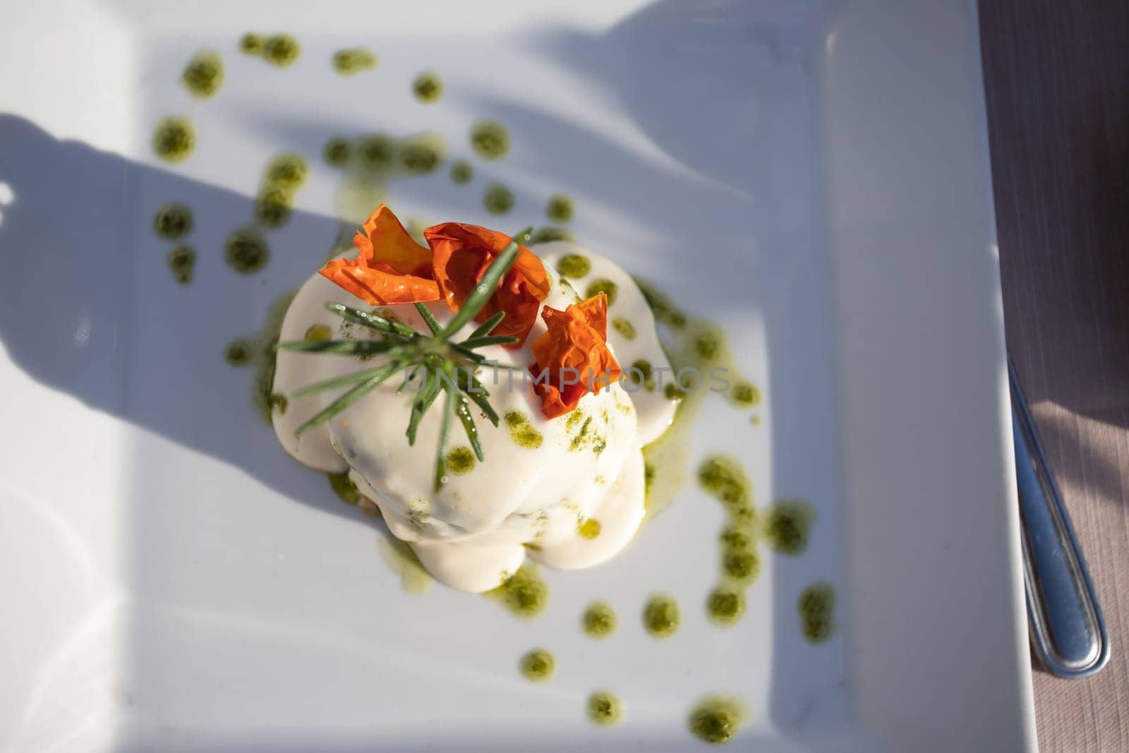 Italian dish, deep fried sliced eggplants baked with mozzarella, parmezan cheese and tomato sauce. Decorated with parsley.