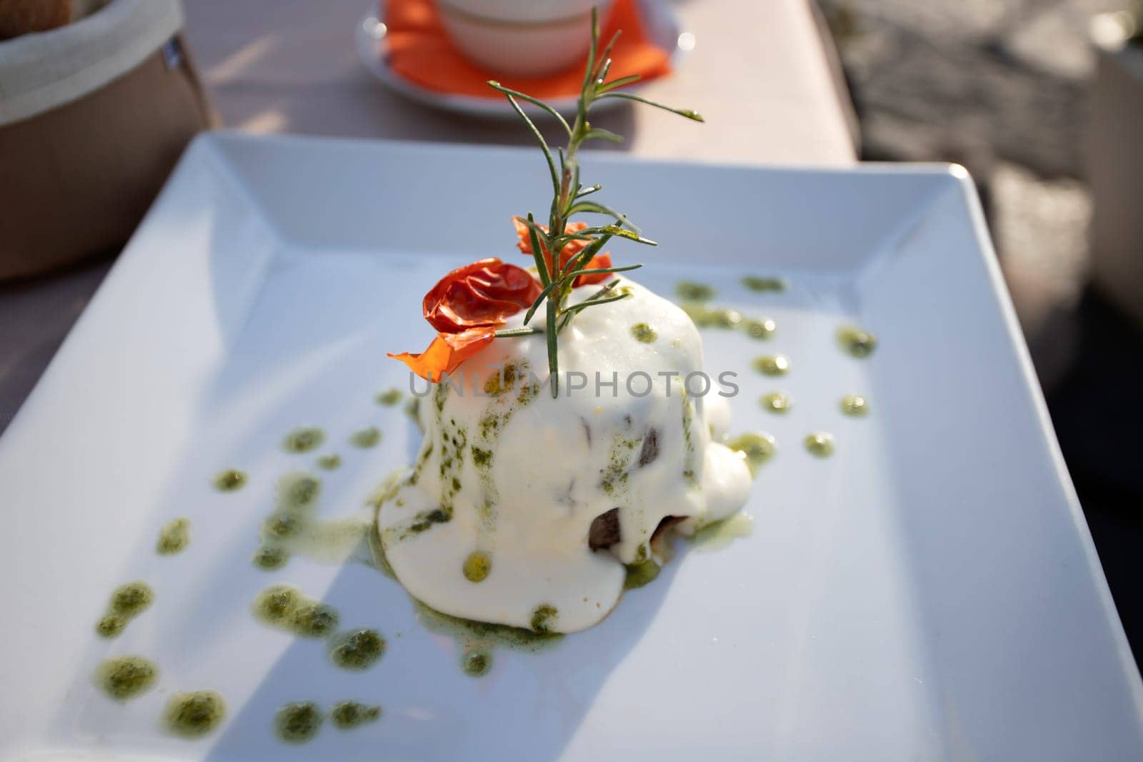 Italian dish, deep fried sliced eggplants baked with mozzarella, parmezan cheese and tomato sauce. Decorated with parsley.