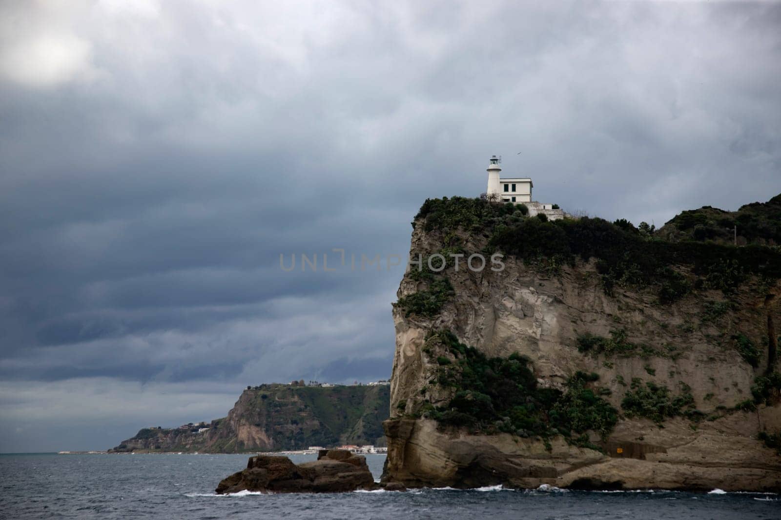 Capo Miseno and its lighthouse that marks the northwestern limit of the Gulf of Naples, Italy
