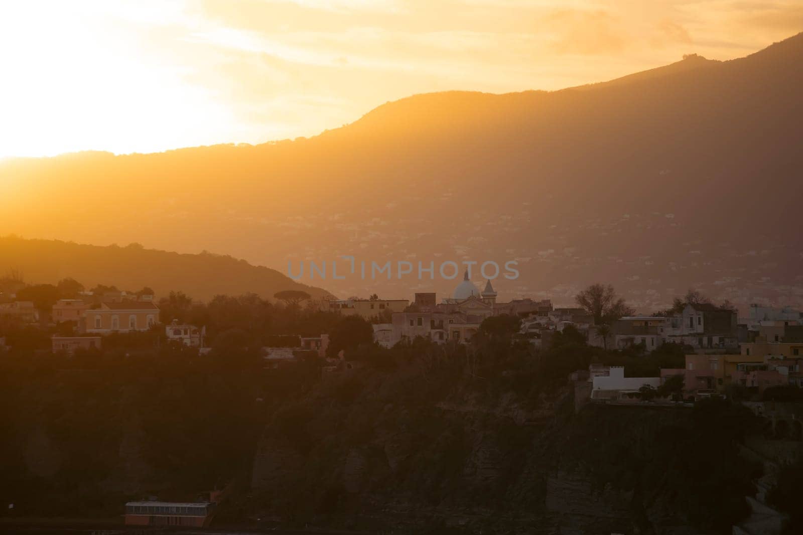 Magic sunset over Procida Island with Ischia island in the background.