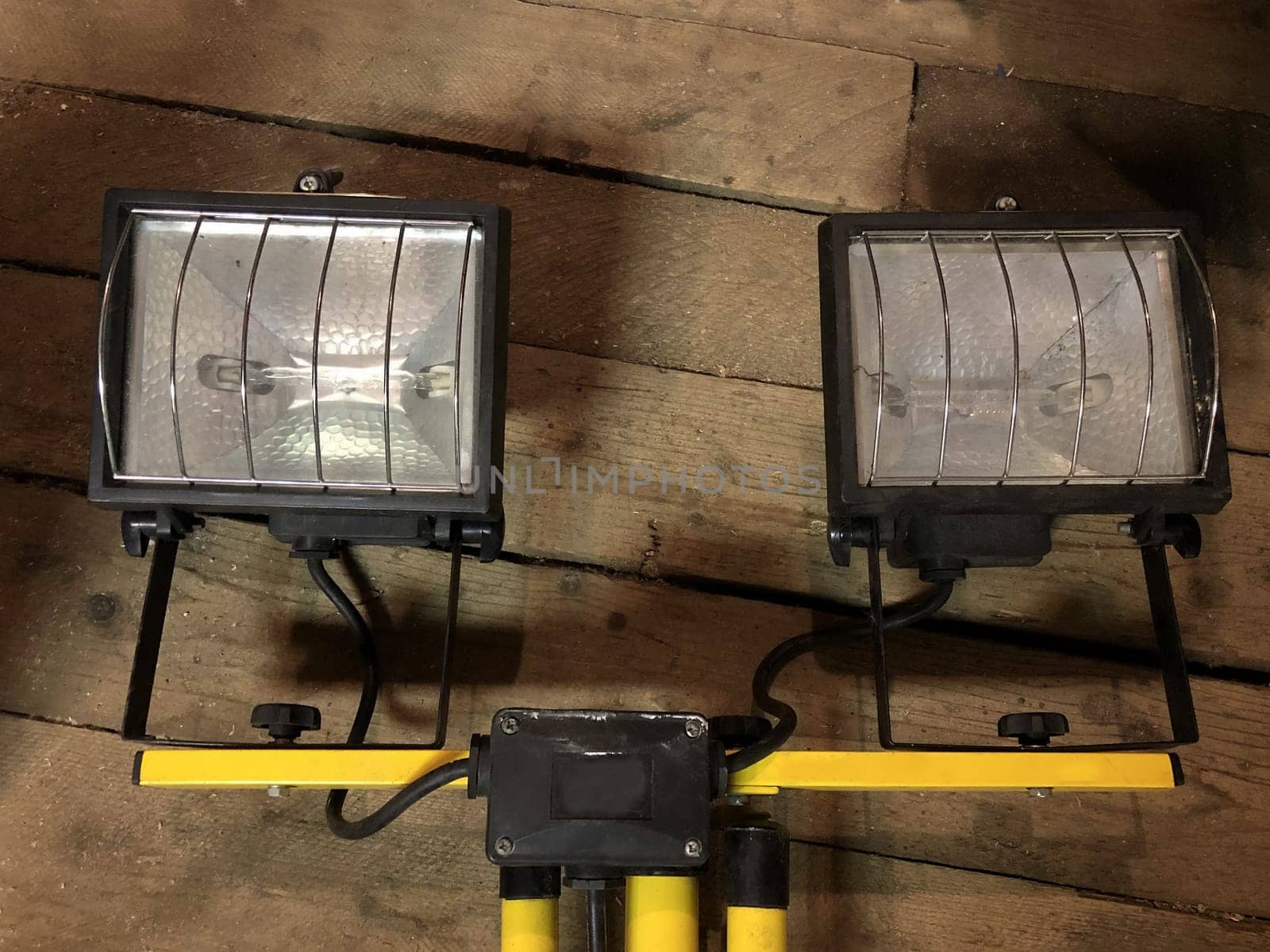 two halogen spotlights in a wooden barn