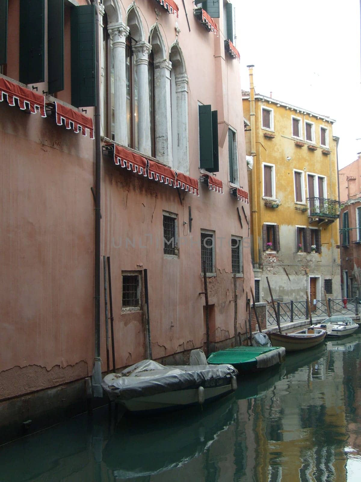 Venice, Italy, 02.22.2007. Venetian streets with graceful building facades. Grand Canal. Along the canal are Gothic and Renaissance palaces. Sights of Italy. Tourism business