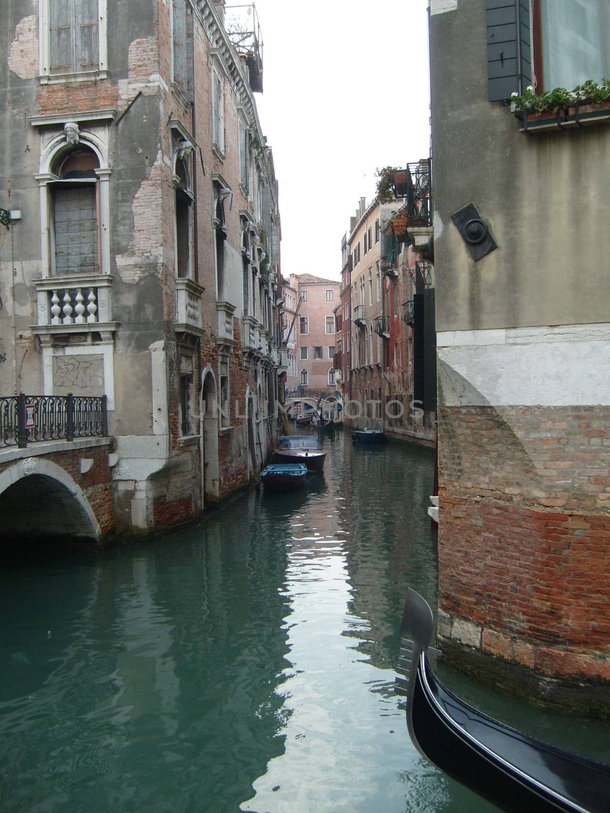 Venice, Italy, 02.22.2007. Venetian streets with graceful building facades. Grand Canal. Along the canal are Gothic and Renaissance palaces. Sights of Italy. Tourism business