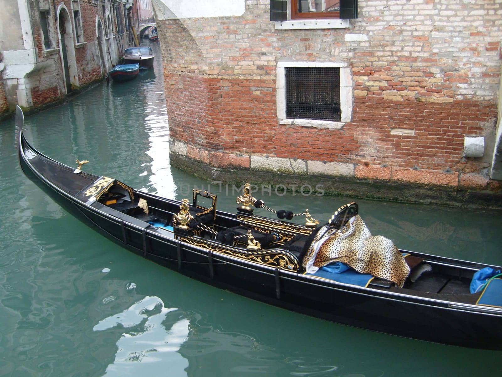 Venice, Italy, 02.22.2007. Venetian streets with graceful building facades. Grand Canal. Along the canal are Gothic and Renaissance palaces. Sights of Italy. Tourism business
