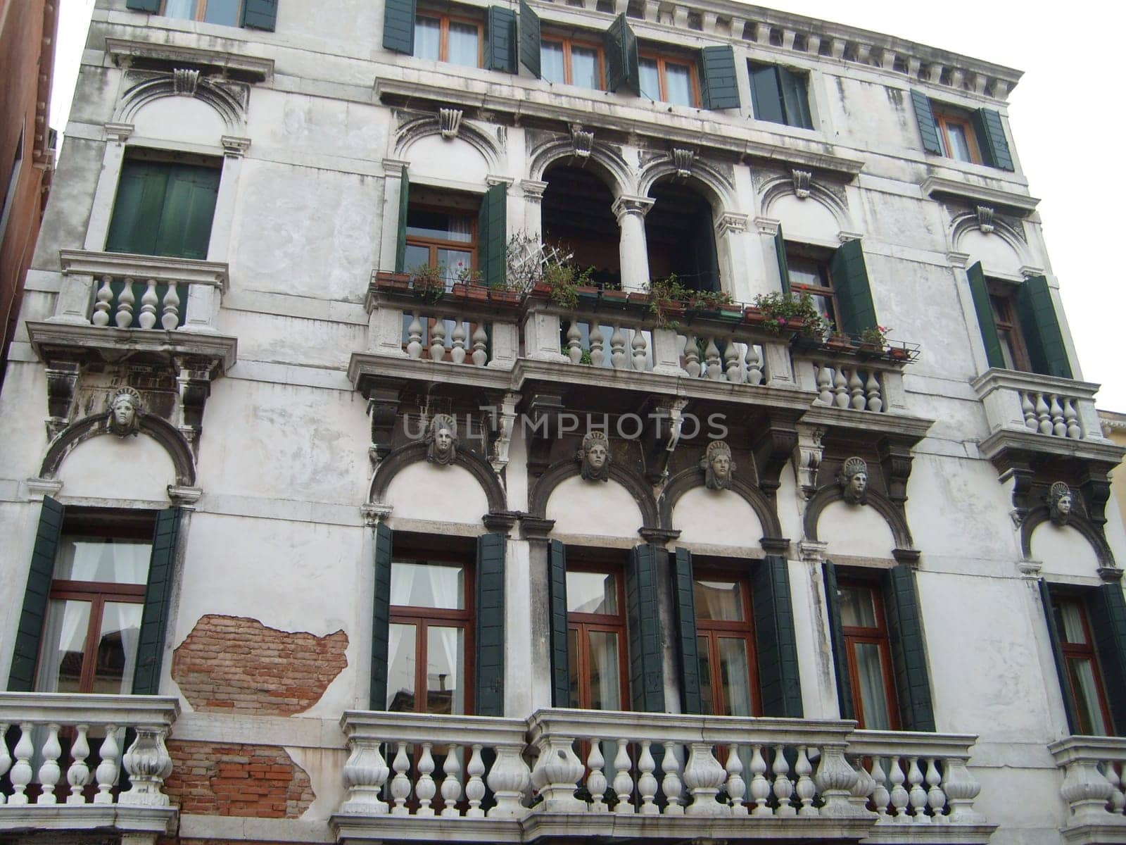 Venice, Italy, 02.22.2007. Venetian streets with graceful building facades. Grand Canal. Along the canal are Gothic and Renaissance palaces. Sights of Italy. Tourism business