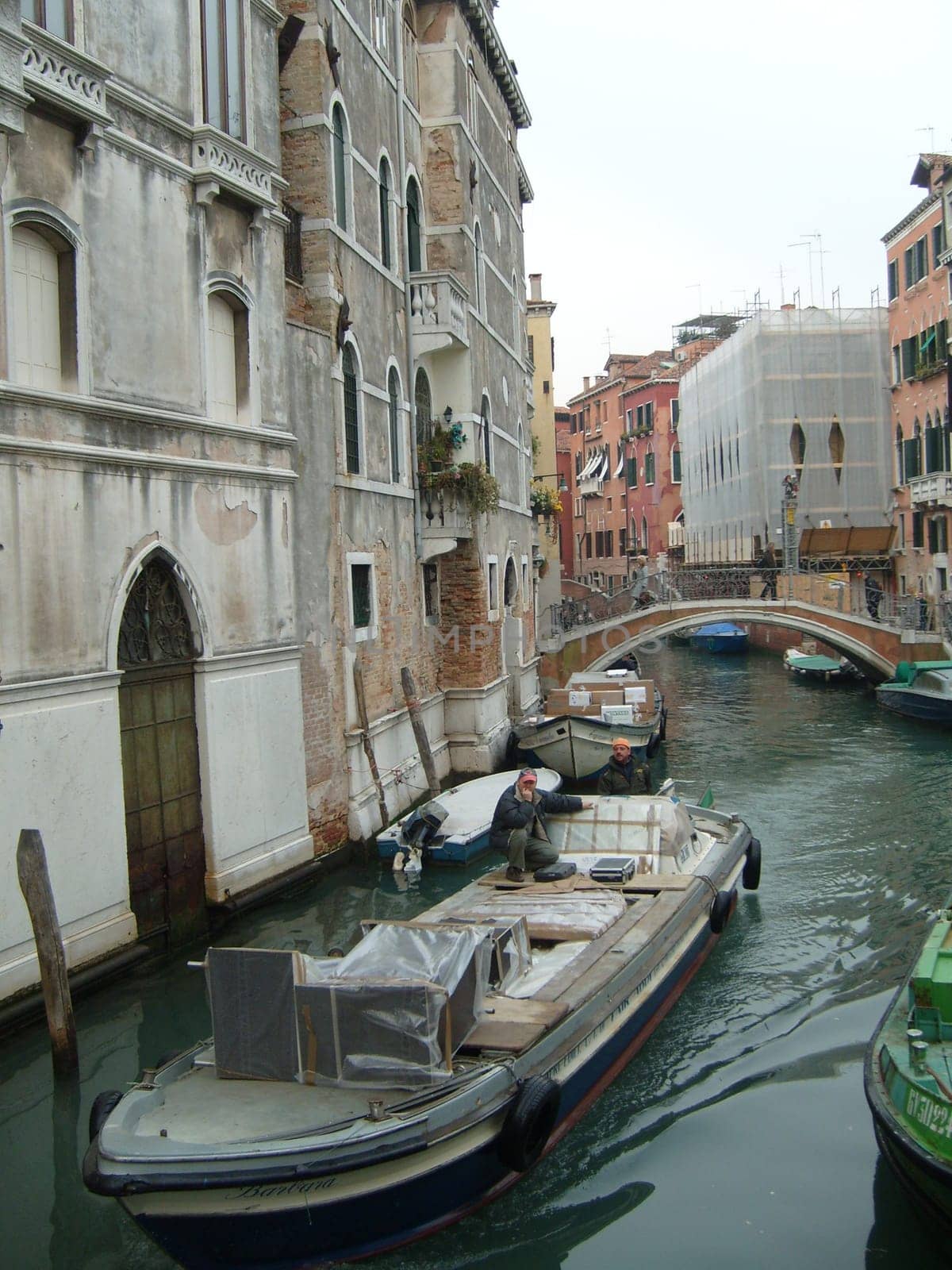 Venice, Italy, 02.22.2007. Venetian streets with graceful building facades. Grand Canal. Along the canal are Gothic and Renaissance palaces. Sights of Italy. Tourism business