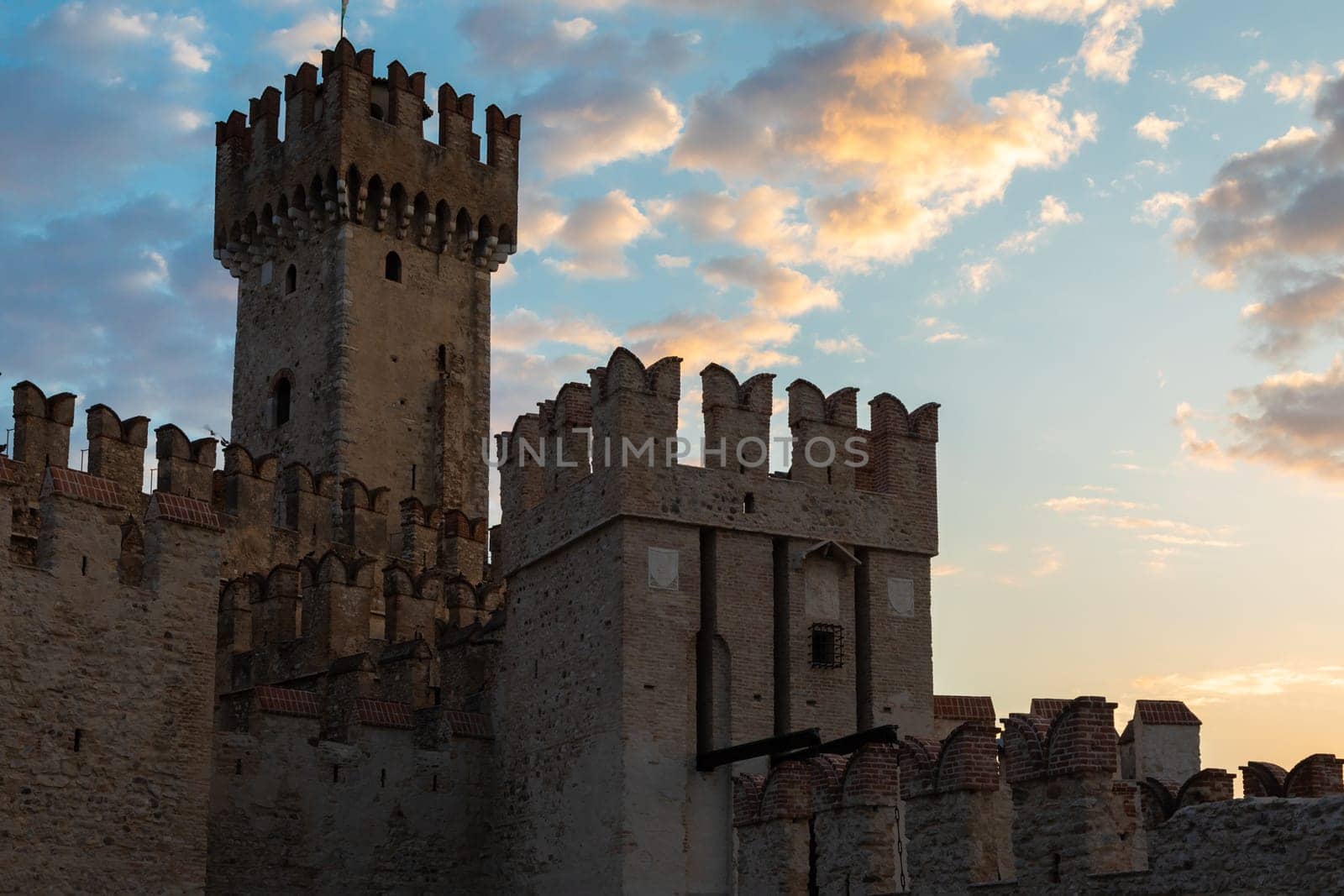Sirmione, Italy - June 2022: Sirmione castle on Garda lake. Scenic mediaeval building on the water
