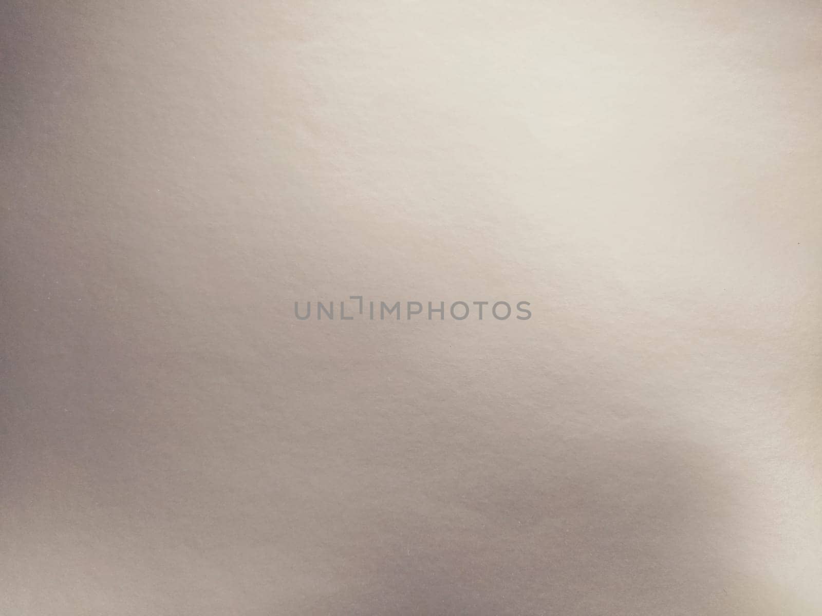 silver gray background with gradient. Light reflective colored paper with a metallic sheen. Background.