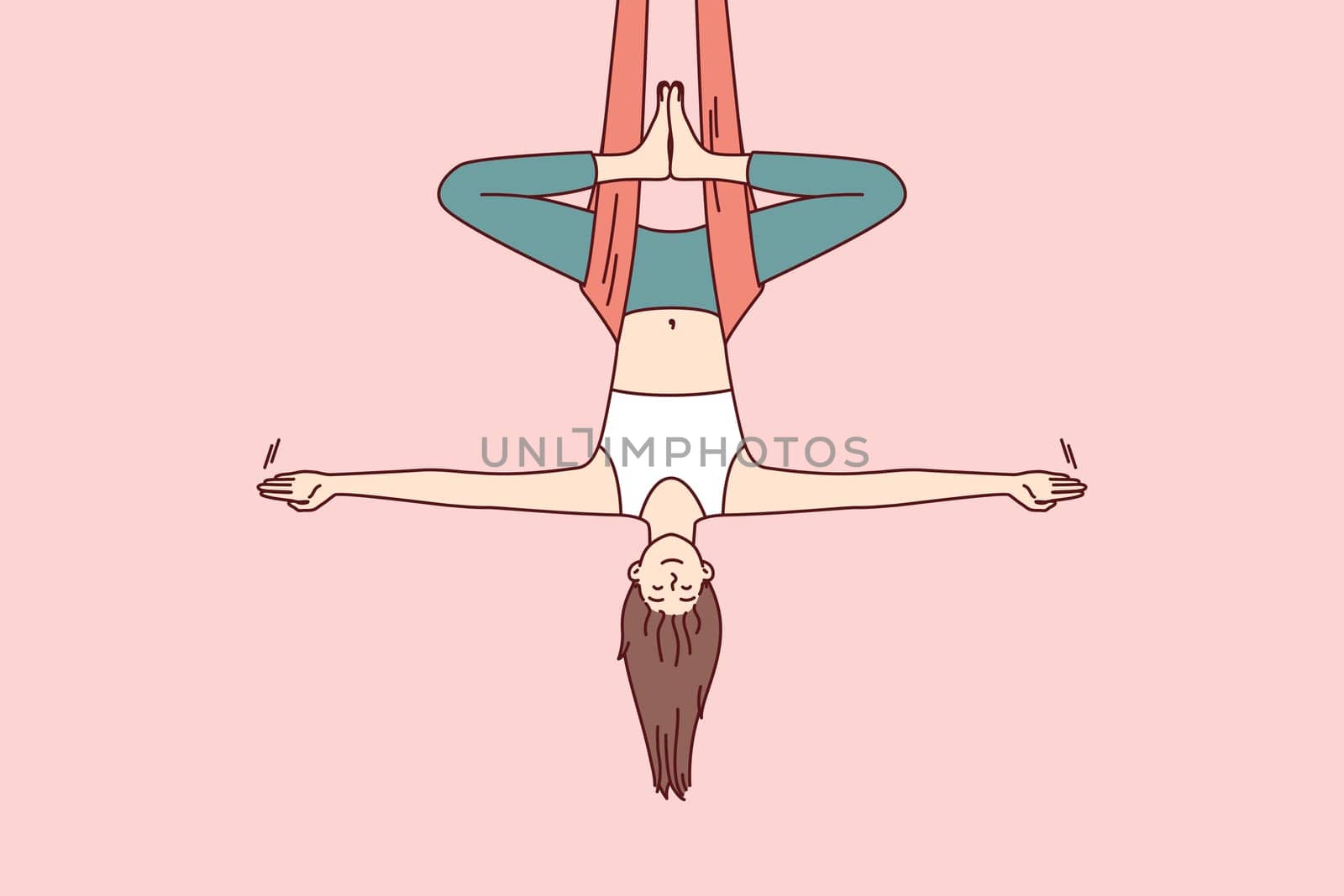 Woman doing aerial yoga hangs upside down in hammock and keeps balance with arms at sides. Girl during workout in yoga studio meditates enjoying practices that cause harmony and get rid of nerves