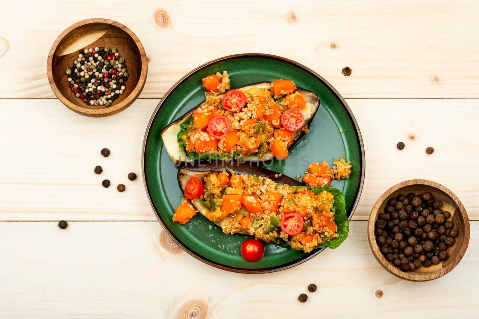 Baked eggplant stuffed with pumpkin and quinoa. Vegetarian food recipe