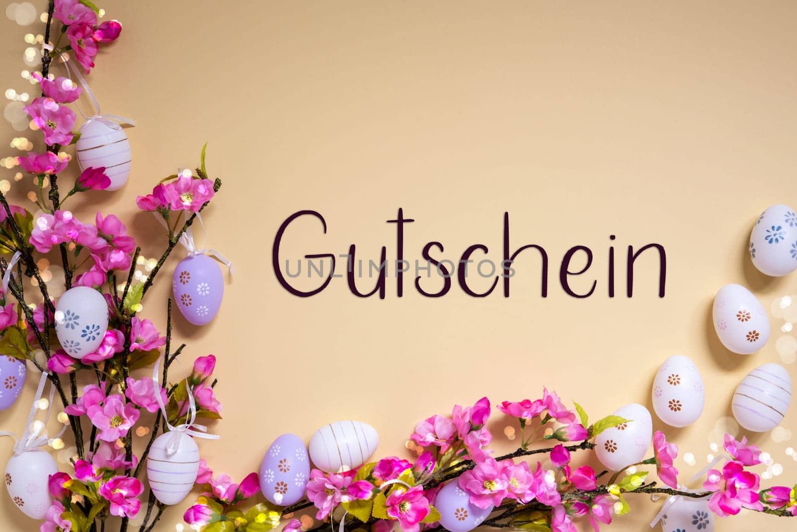 German Text Gutschein Means Voucher On Beige Background. Pink And Purple, Shiny And Bright Spring Flower Arrangement With Easter Egg Decoration.