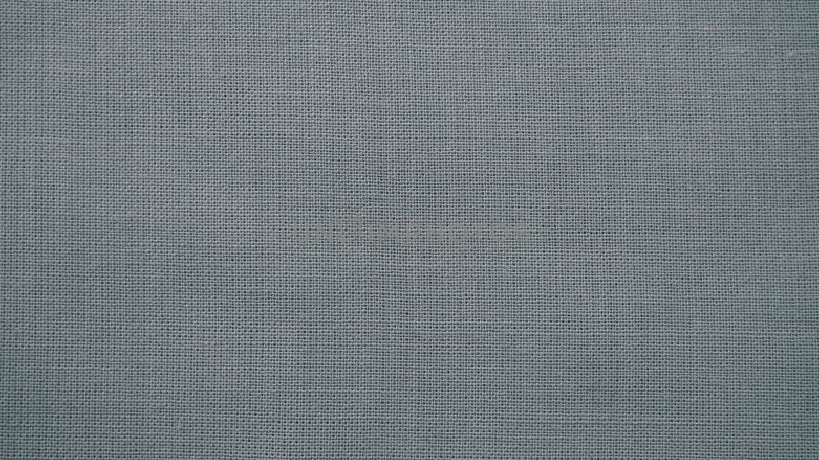 Texture canvas fabric as background. Gray sackcloth. Grey linen scrim.