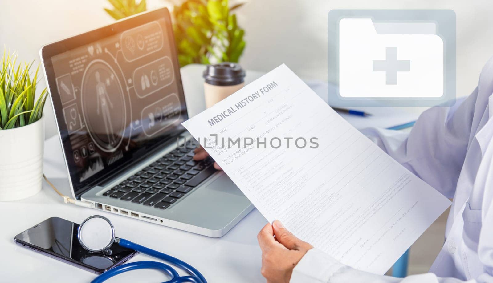 Doctor Day Concept. nurse woman in uniform with doctor stethoscope working typing information of patient prescription medical history form into laptop computer for record document data report