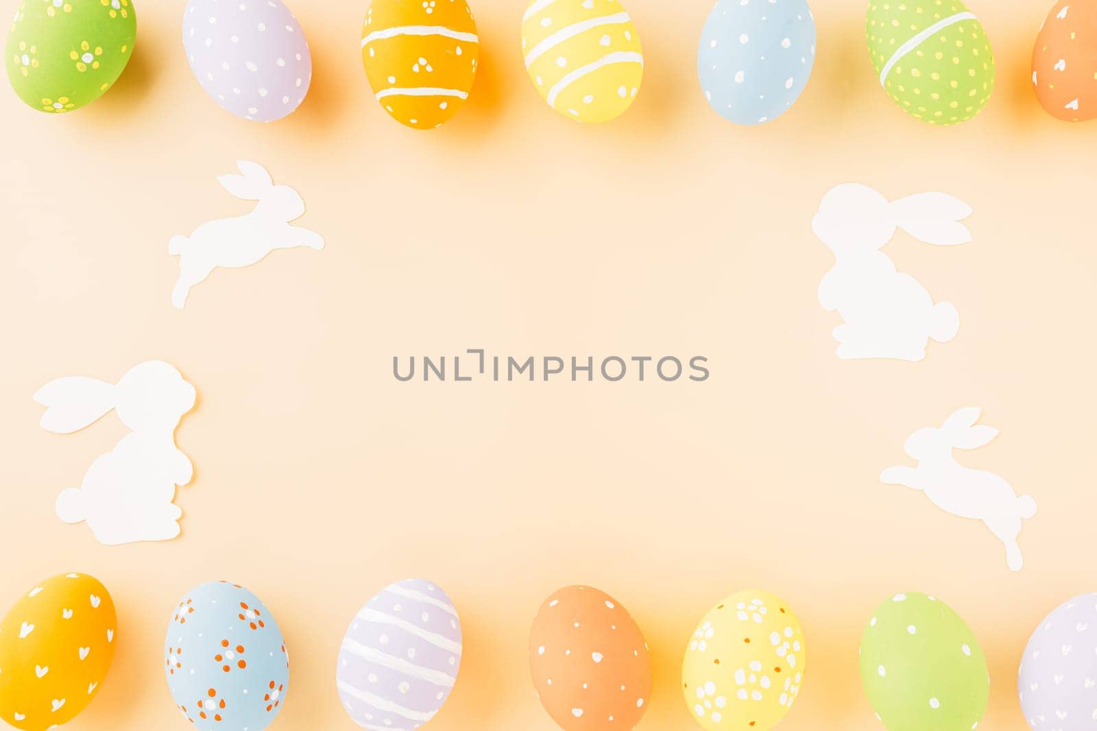 Easter eggs bunny and rabbit white paper cutting isolated on pastel background. Funny decoration, Happy Easter Day, Festive composition banner design holiday background