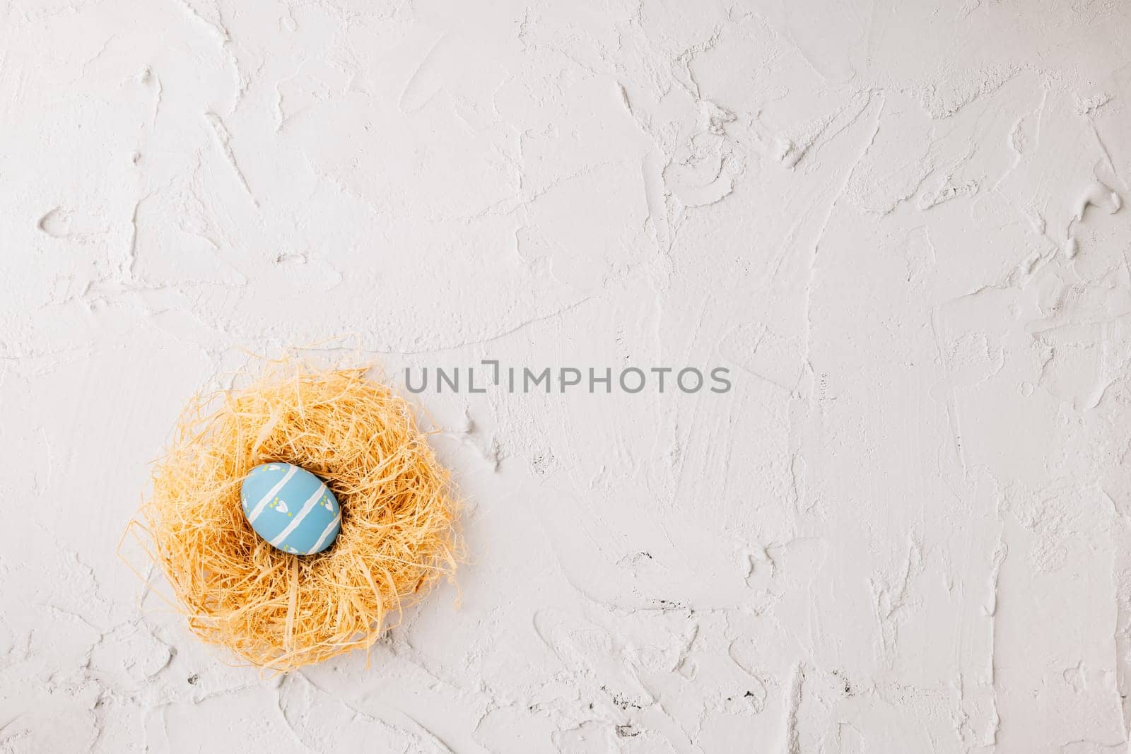 Top view holiday banner background web design white easter eggs in brown nest on white cement background with empty copy space, celebration greeting card, overhead, template, Happy Easter Day Concept