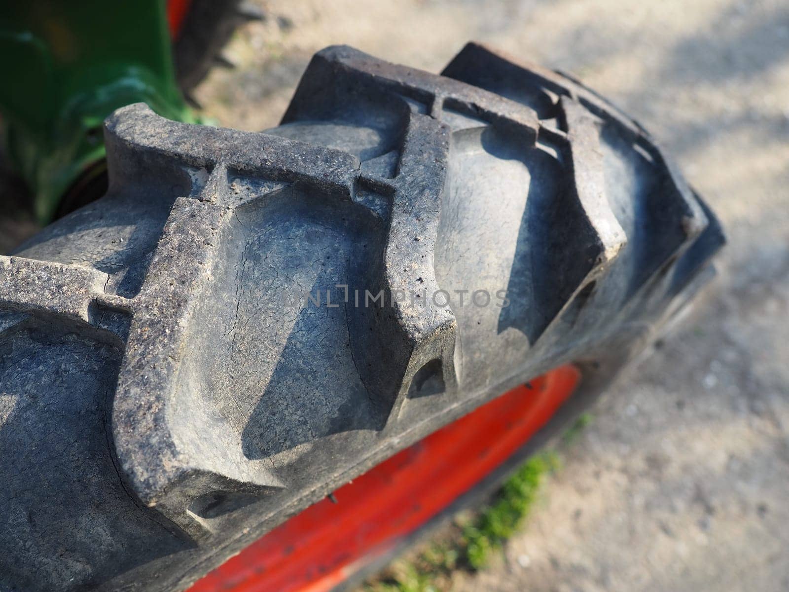tire from a motor-cultivator. A close-up of a wheel from a small farm tractor. Rubber thread. Industrial details