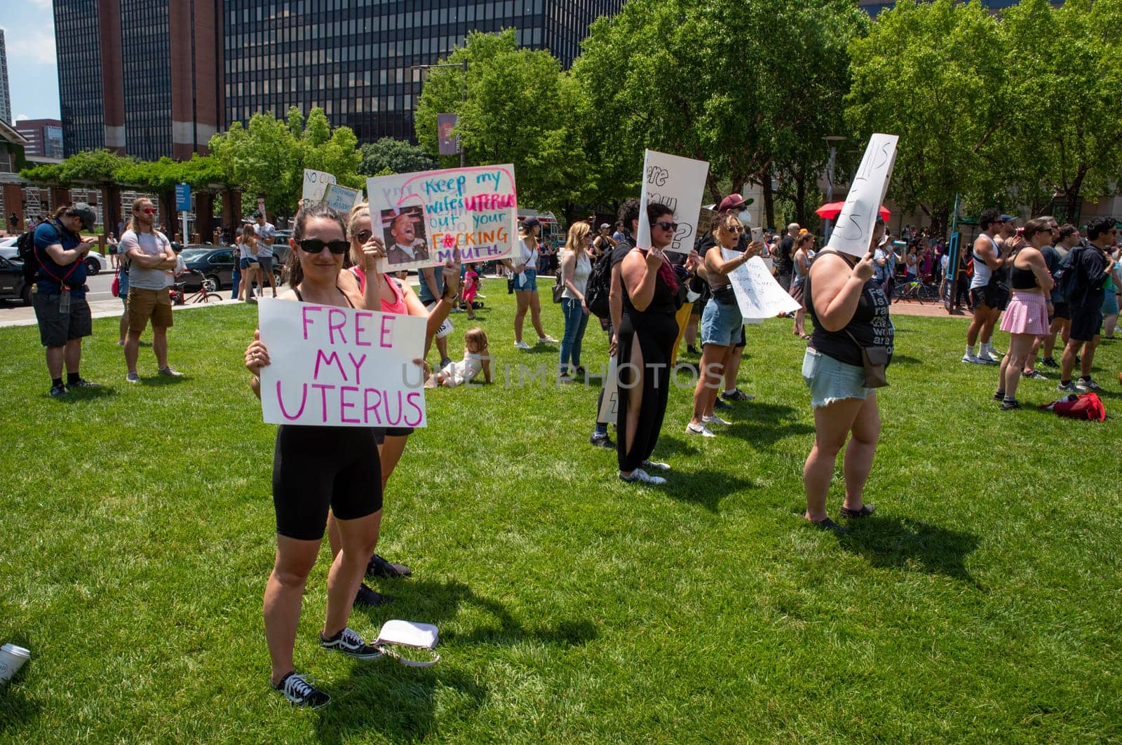 Philadelphia, PA / USA-06/25/2022: Woman in a crowd of men and women at political pro-choice pro-abortion rally holds a FREE MY UTERUS sign. Josh Shapiro rally. Editorial use only.