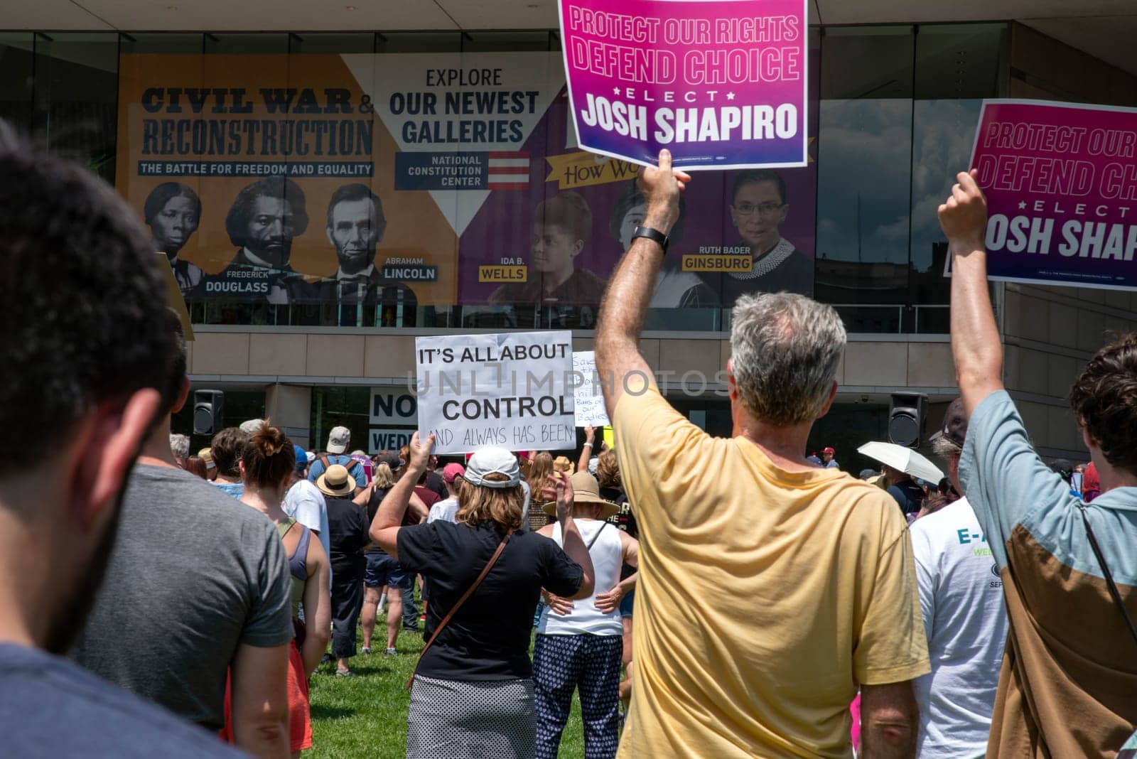 Philadelphia, PA / USA-06/25/2022: Crowd at a Josh Shapiro pro-choice rally hold feminist and political signs. Men and women holding pro-choice signs. ELECT JOSH SHAPIRO and IT'S ALL ABOUT CONTROL