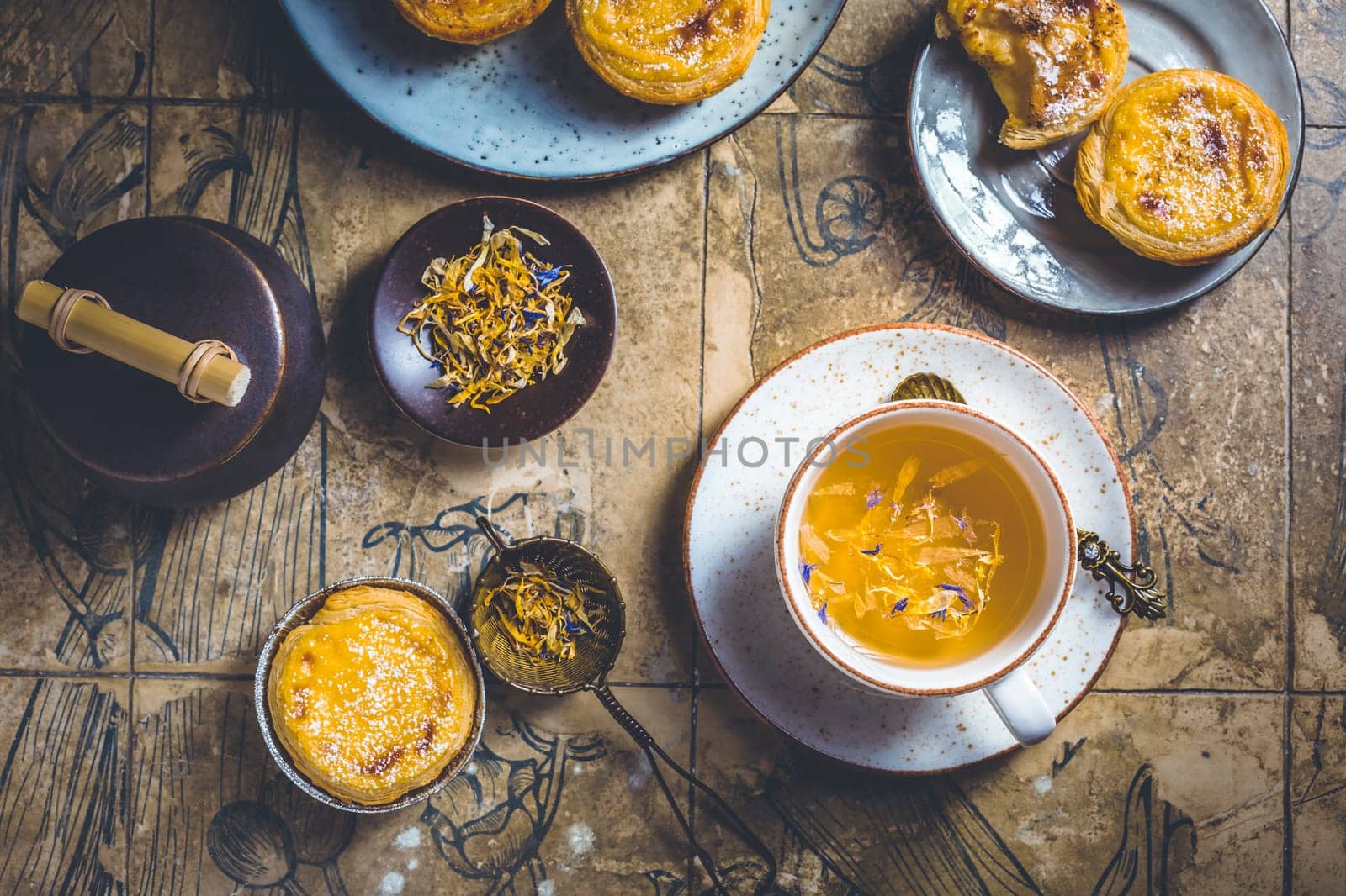 Pastel de nata with cup of herbal tea, Portugal sweet egg and pudding pastry