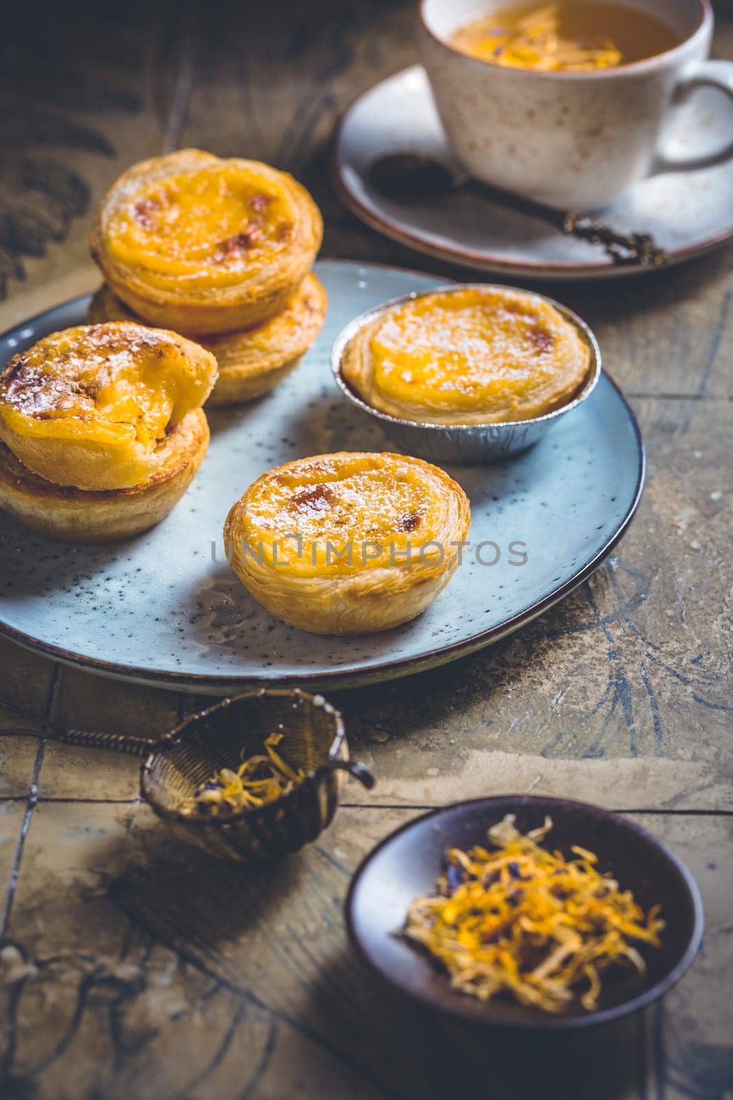 Pastel de nata with cup of herbal tea, Portugal sweet egg and pudding pastry