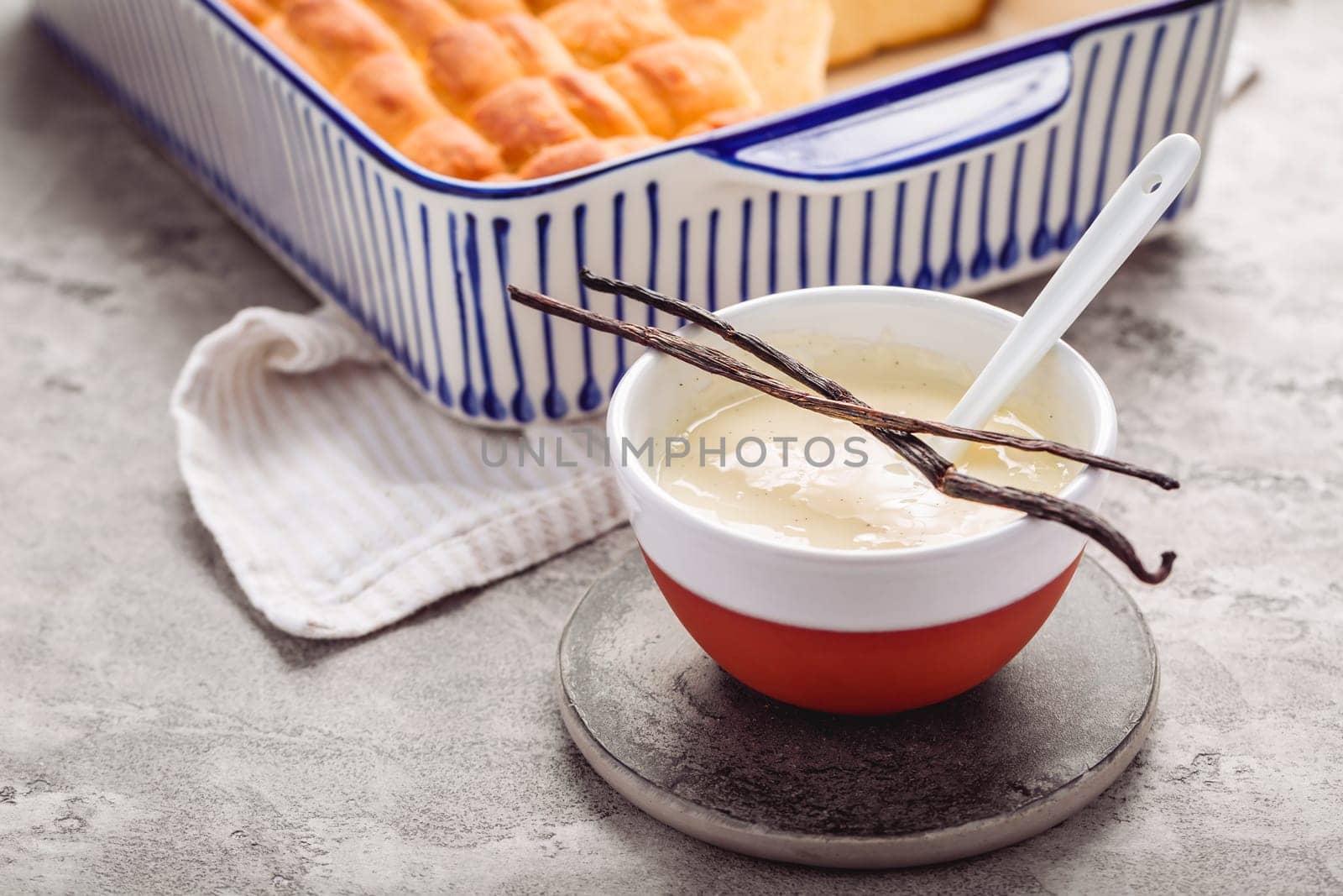 Buchteln, sweet rolls made of yeast dough with milk and butter, served with vanilla sauce. Traditional meatless dish in Europe