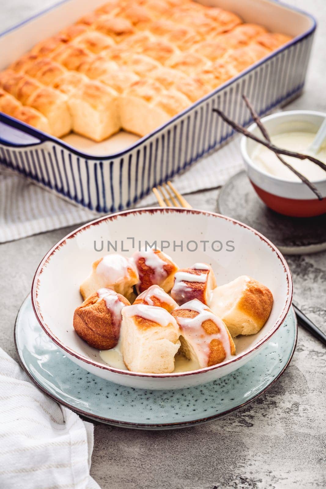 Buchteln, sweet rolls made of yeast dough with milk and butter, served with vanilla sauce. Traditional meatless dish in Europe