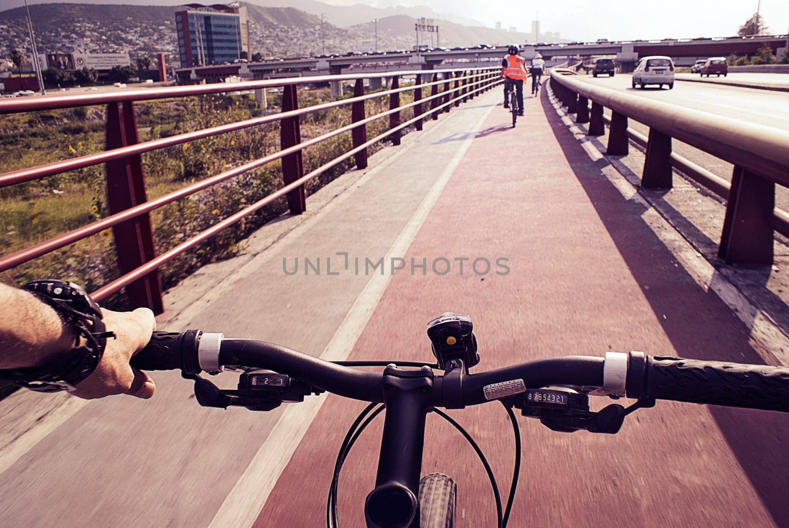 Photograph of some cyclists on a urban bicycle track
