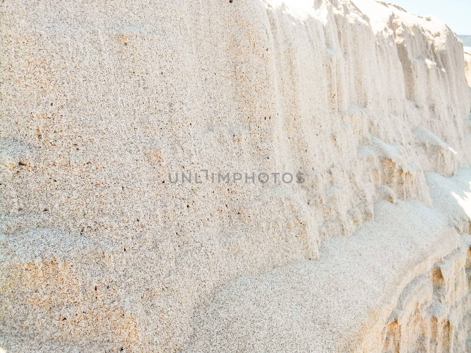 cliffs sand grains. In front of a mountain of sand