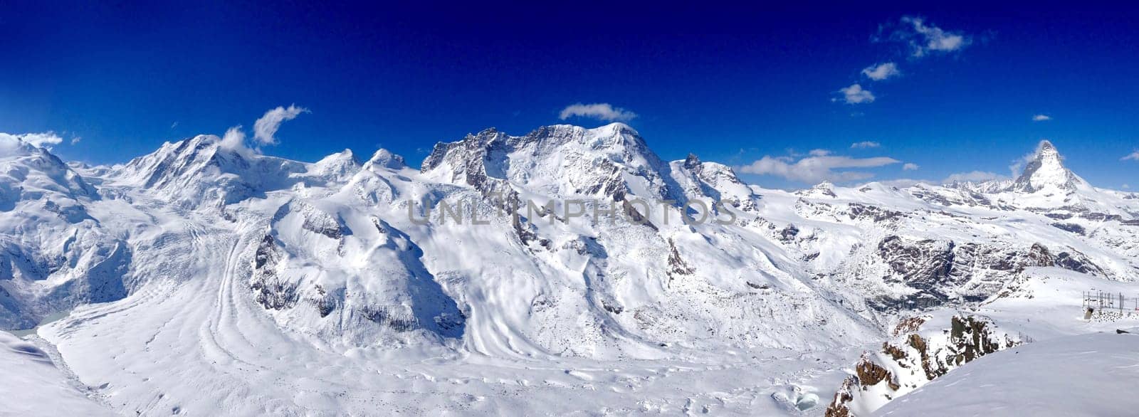 Panorama of Matterhorn snow mountains on a clear sunny day, Zermatt, Switzerland
