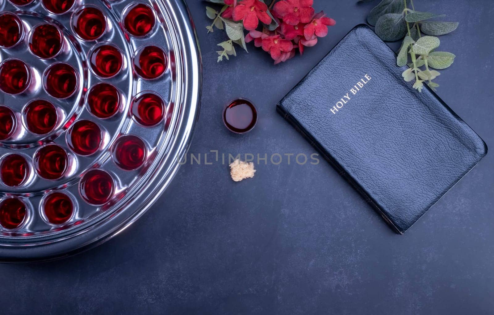 Taking communion concept - the wine and the bread symbols of Jesus Christ blood and body with Holy Bible. Easter Passover and Lord Supper concept.