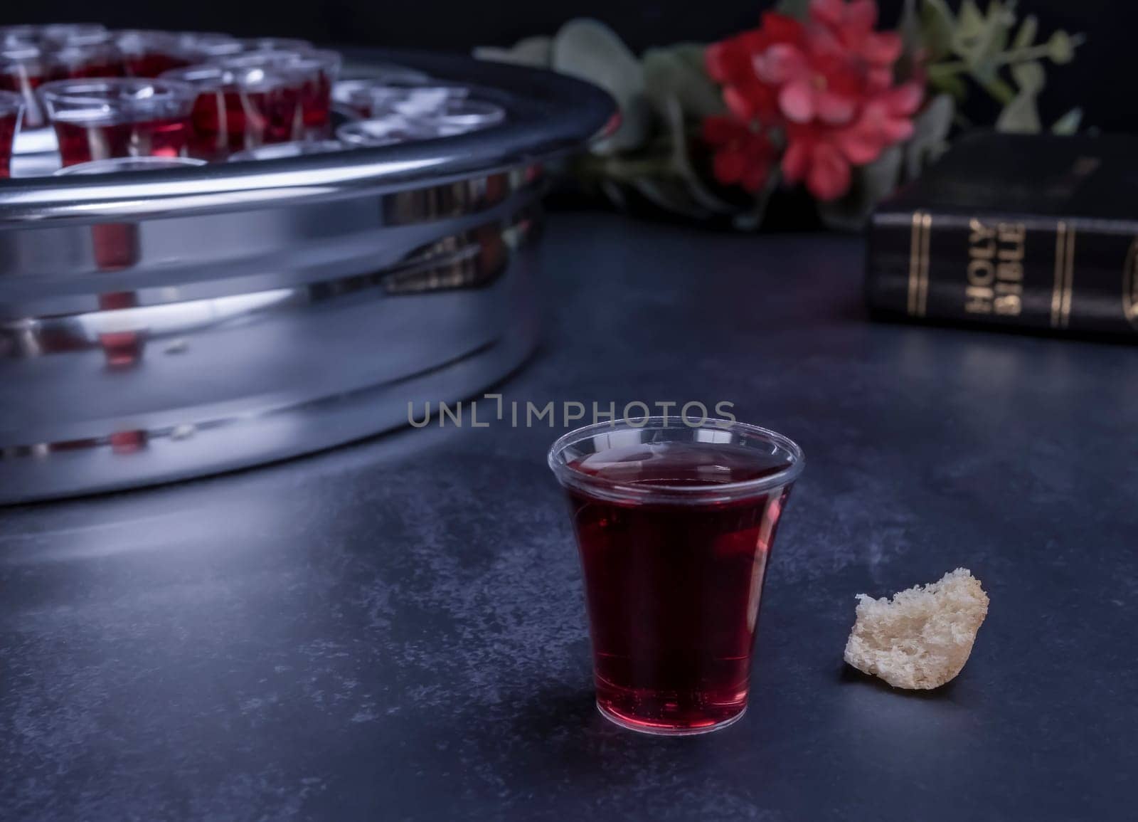 Taking communion concept - the wine and the bread symbols of Jesus Christ blood and body with Holy Bible. Easter Passover and Lord Supper concept.