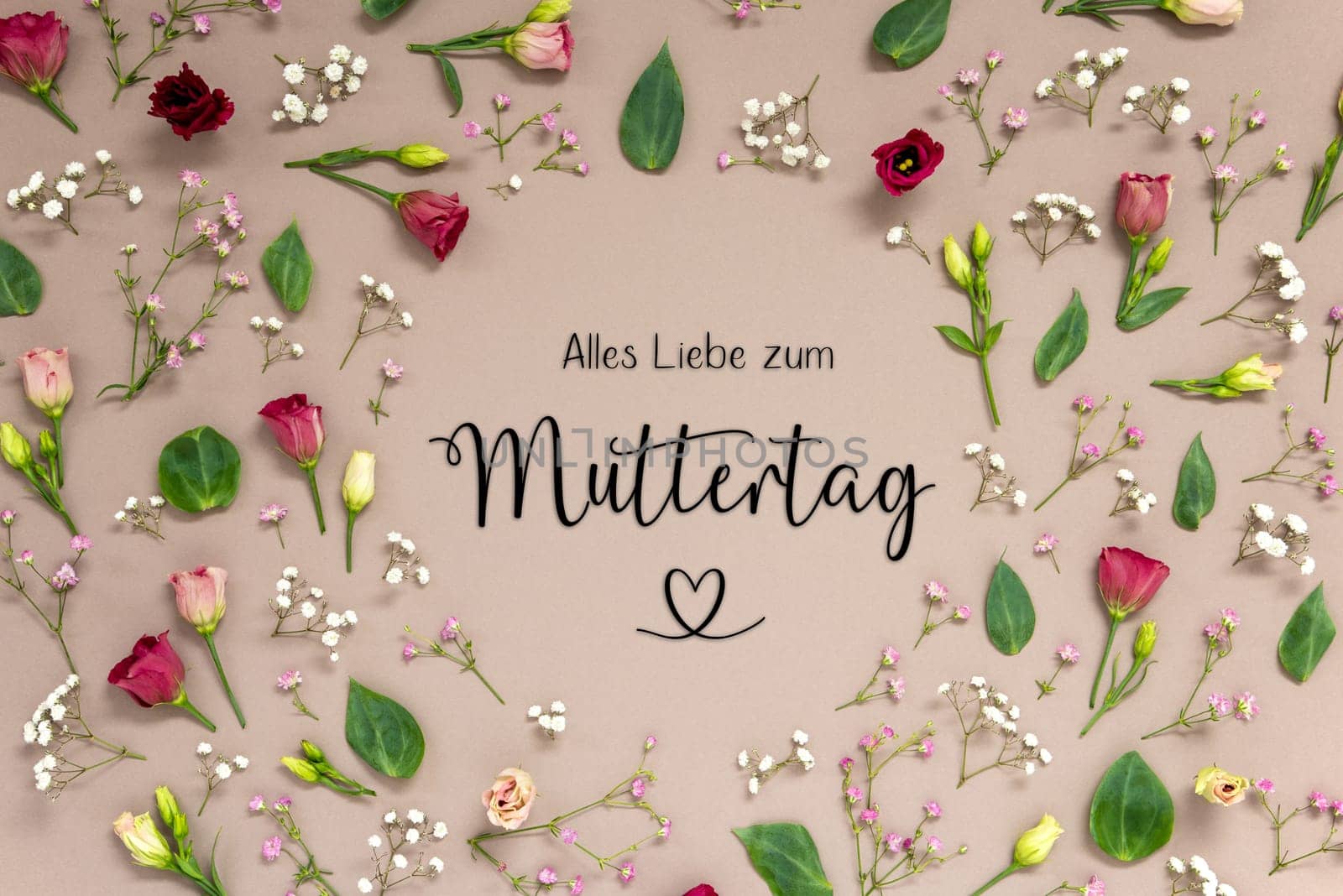 Flower Arrangement With German Text Alles Liebe Zum Muttertag Means Happy Mothers Day. Colorful Spring Blossoms And Flowers Like Roses Building A Frame. Flat Lay With Brown Paper Background