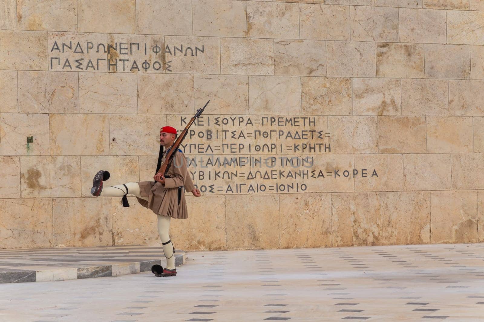 ATHENS, GREECE - MAY 06 2022: Presidential ceremonial guards - Evzones at the Tomb of the Unknown Soldier in front of the Greek Parliament, Athens, Greece