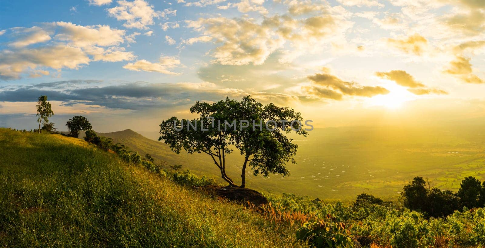 Mountain landscape with colorful vivid sunset on the cloudy sky,Sunset in nature with lighted clouds