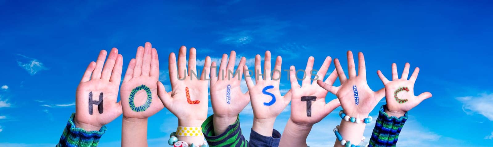 Children Hands Building Colorful English Word Holistic. Blue Sky As Background.