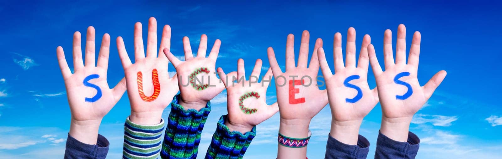 Children Hands Building Colorful English Word Success. Blue Sky As Background