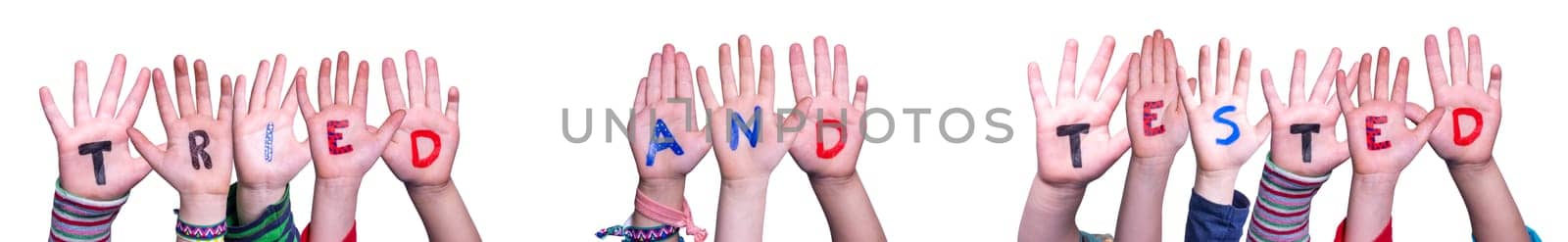 Children Hands Building Colorful English Word Tried And Tested. White Isolated Background