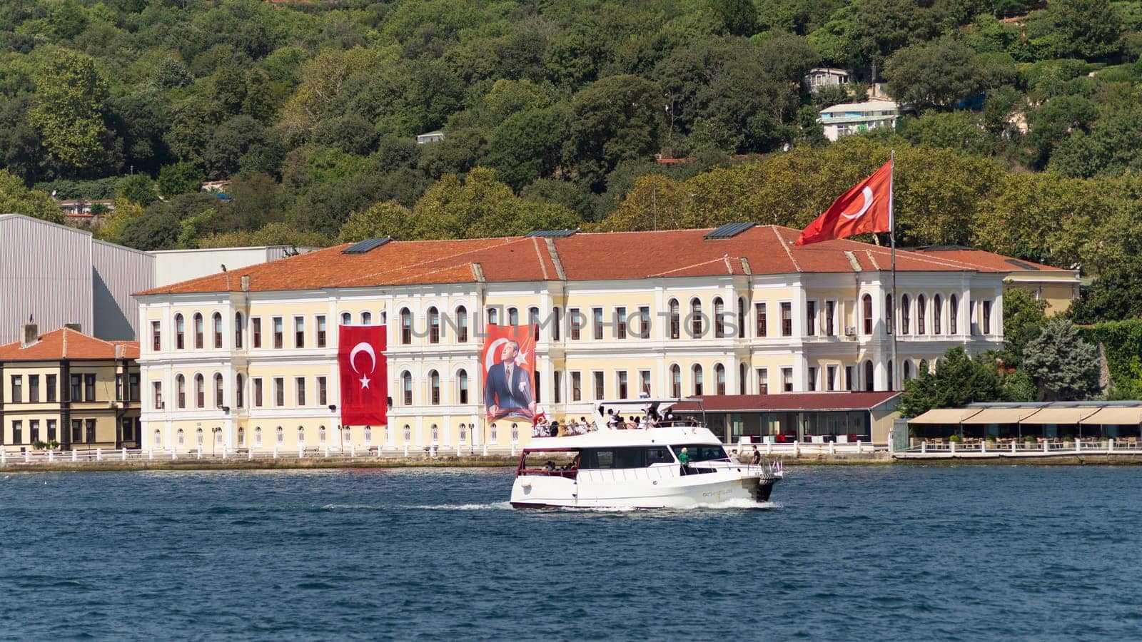 Istanbul, Turkey - August 29, 2022: Morning view in a sunny day of Kabatas Erkek Lisesi building, or Kabatas High School, suited by Bosphorus Strait in Ortakoy, Besiktas