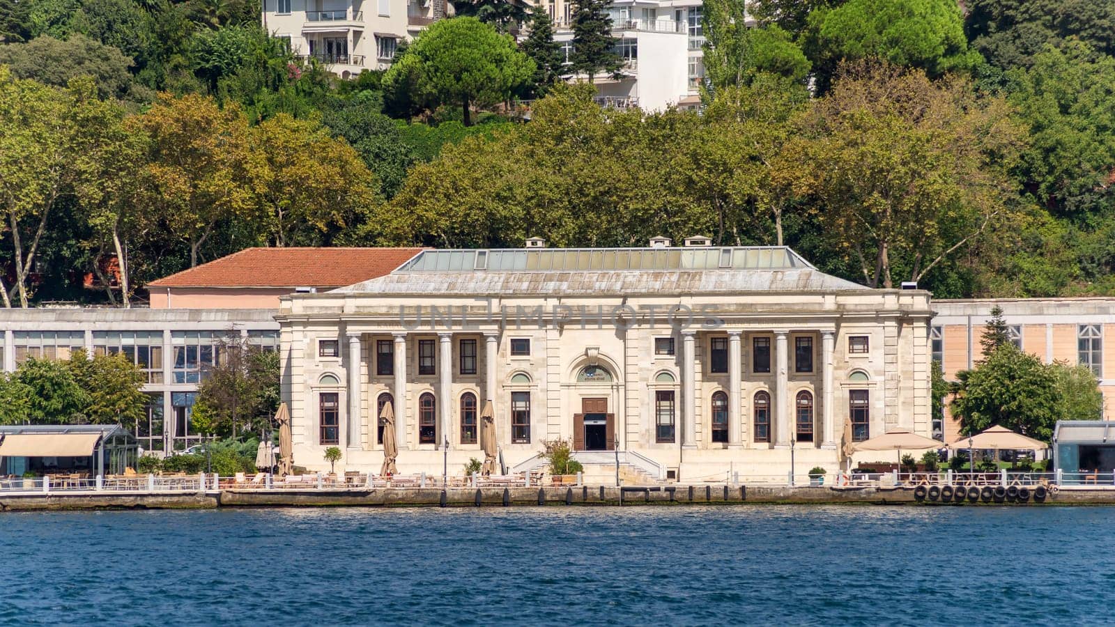 Morning view in a sunny day of Kabatas Boys High School, Kabatas Erkek Lisesi Egitim Vakfi building, suited by Bosphorus Strait in Ortakoy, Besiktas, Istanbul, Turkey