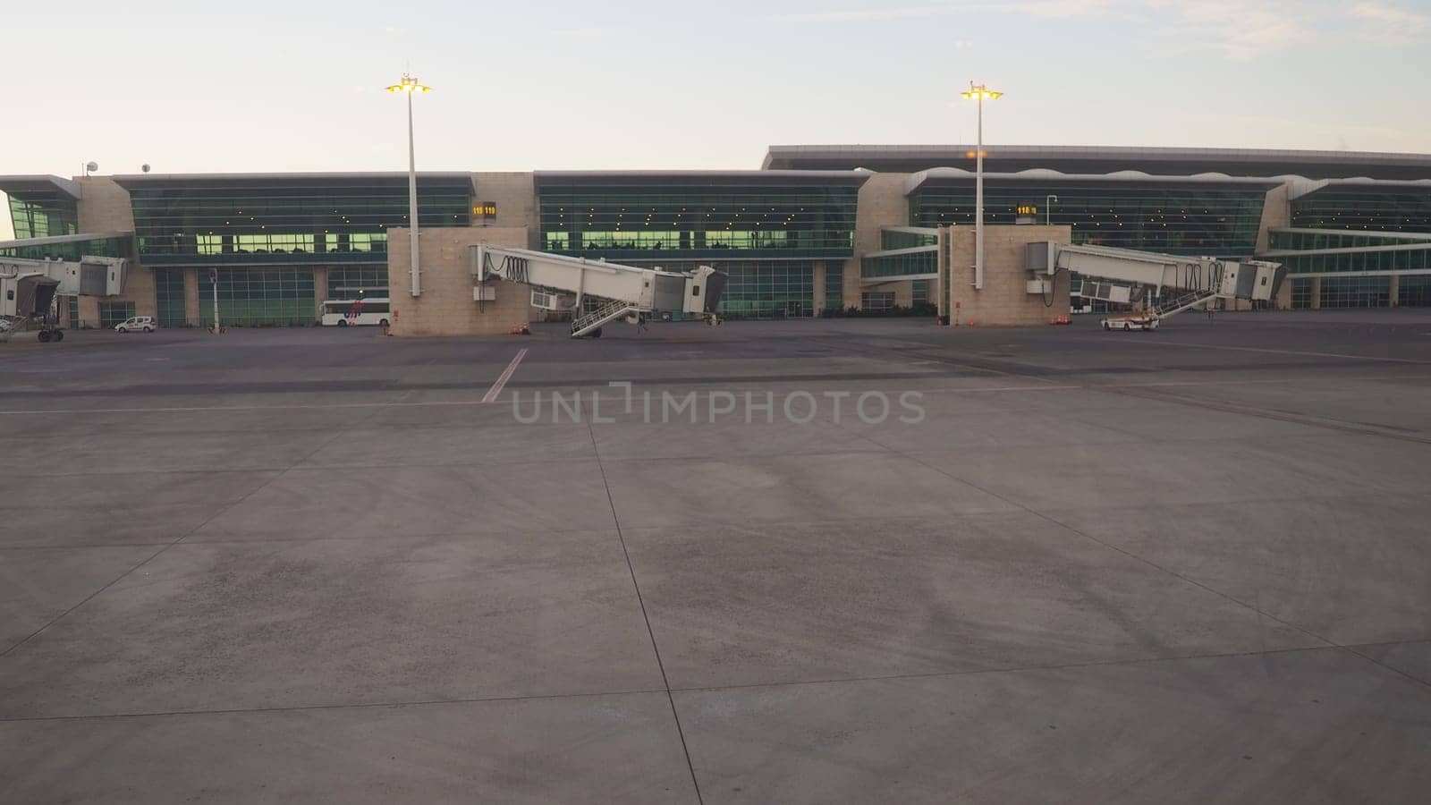 Ankara, Turkey, January 18, 2023. Shot from the window of an aircraft moving along the airfield. Terminals and buildings of Ankara Esenboga Havalimani Airport. International and domestic flights