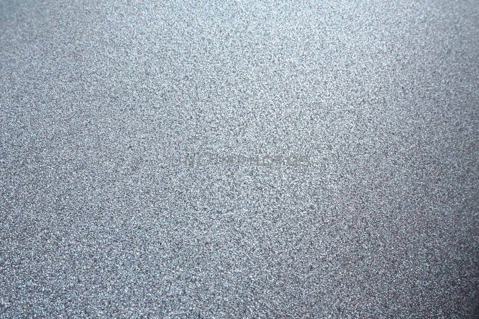 silver gray glitter texture christmas background. Bent shiny velvet paper.