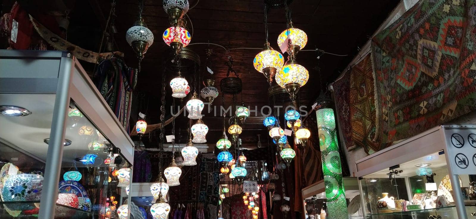Traditional vintage Turkish lamps over light background in the night. Colored glass lamps and shades on the market in Sarajevo, Bosnia and Herzegovina. Sale of souvenirs in the market