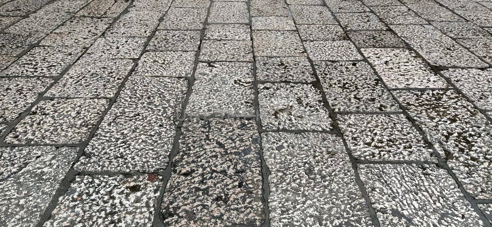 White marble natural pattern for background. marble surface. Sarajevo, Bosnia and Herzegovina, historic center. Close-up of the pavement near the mosque. Light marble or stone