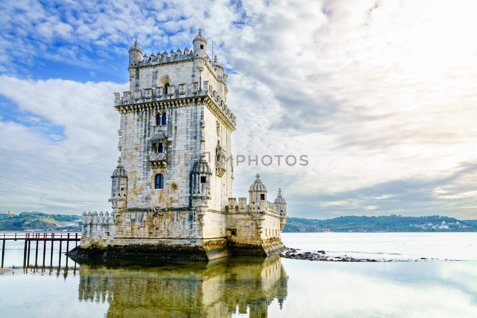 View of Torre de Belem or Bethlehem Tower against the Tagus River in Lisbon, Portugal