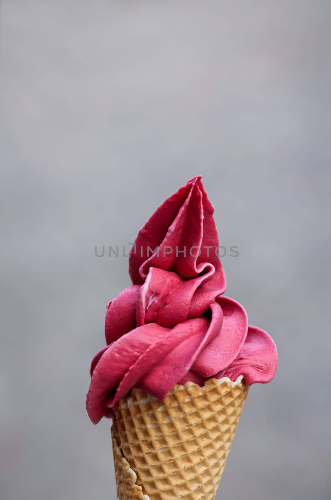 An ice cream cone with soft ice cream, Waffle ice cream, An ice cream cone made of wafer.