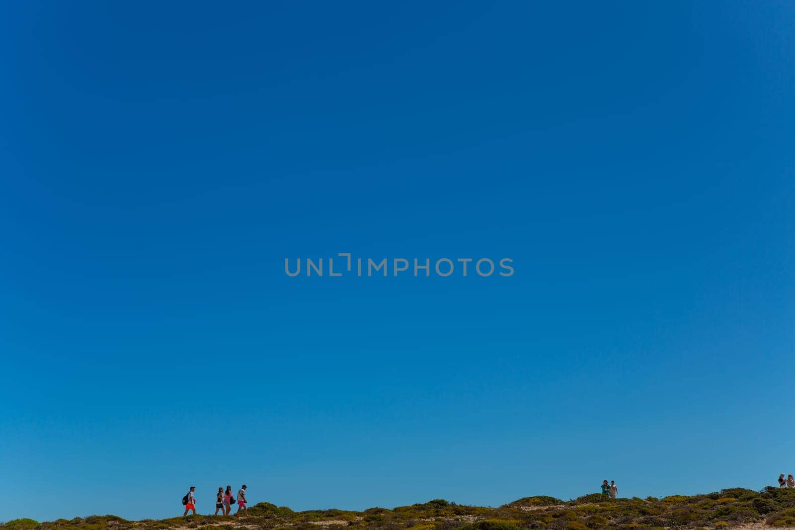 Sagres, Portugal - August 25, 2022: People at the cliff in Sagres village in Algarve, Portugal