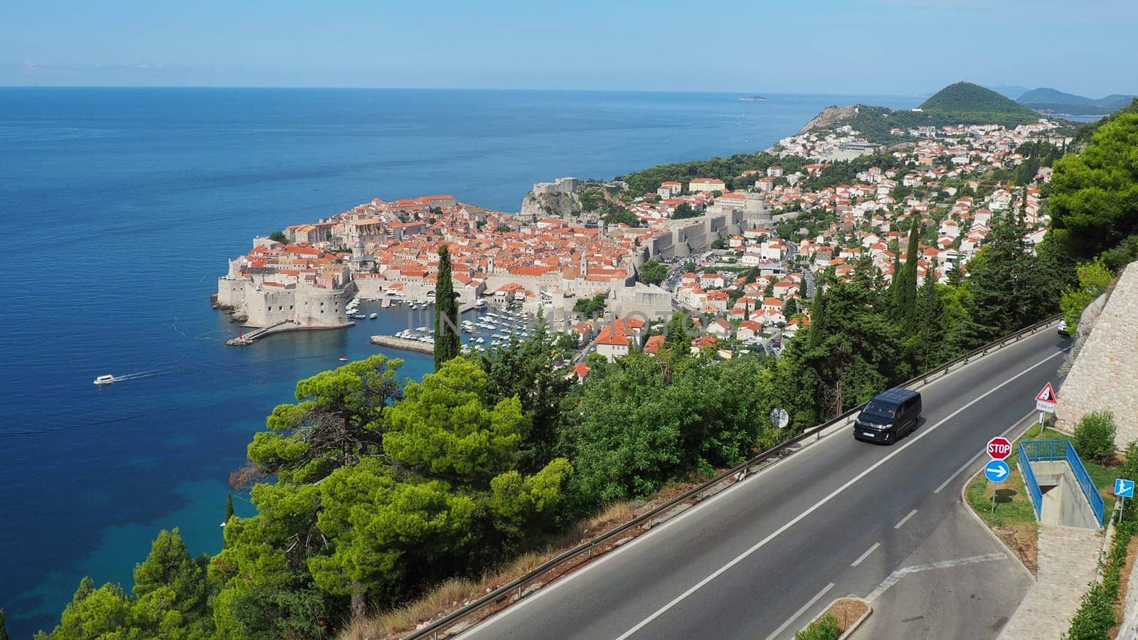 Dubrovnik, Croatia 08.14.2022 Road traffic near Dubrovnik old town in Croatia. Dubrovnik Ragusa administrative center of the Dubrovnik-Neretva County. Top view from the observation deck on the rock