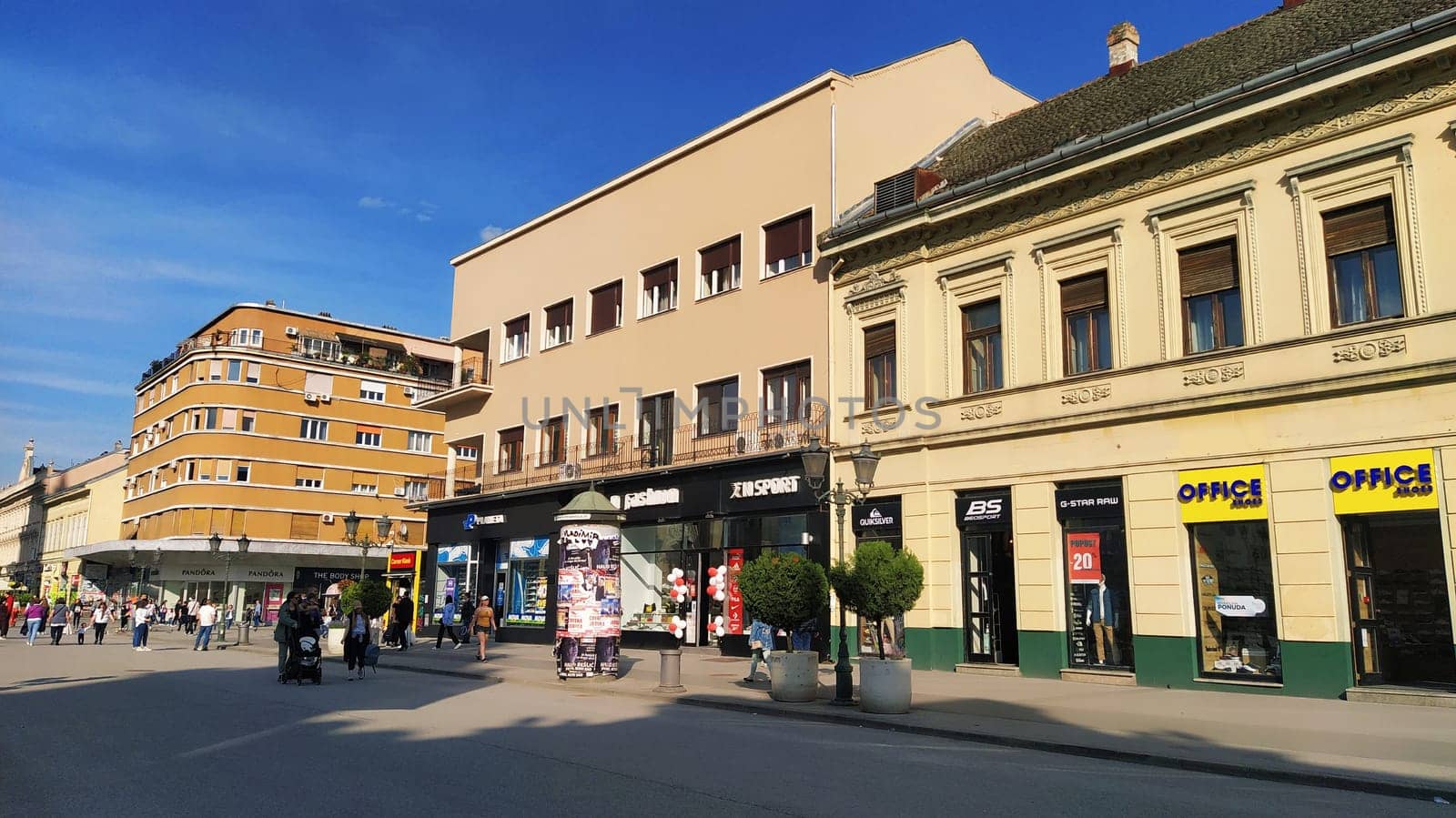 Novi Sad, Serbia 30 April 2022 Hotel Vojvodina is the oldest hotel in the center of the city. European tourism facility. Street with passers-by. Freedom Square. Hotel with rooms provision of services.